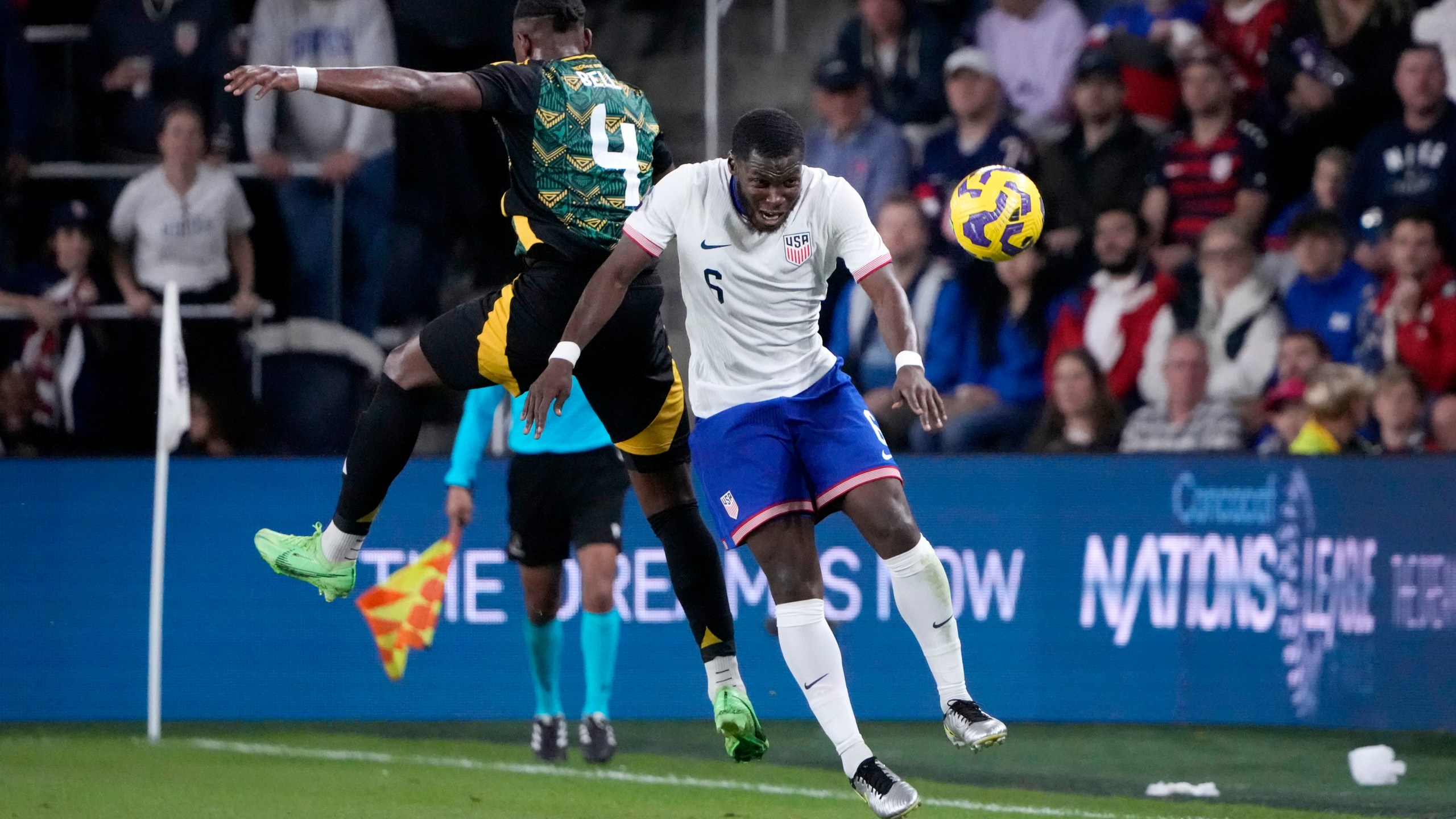 United States' Yunus Musah (6) and Jamaica's Amari'i Bell (4) battle for the ball during the first half in a CONCACAF Nations League quarterfinal second leg soccer match Monday, Nov. 18, 2024, in St. Louis. (AP Photo/Jeff Roberson)