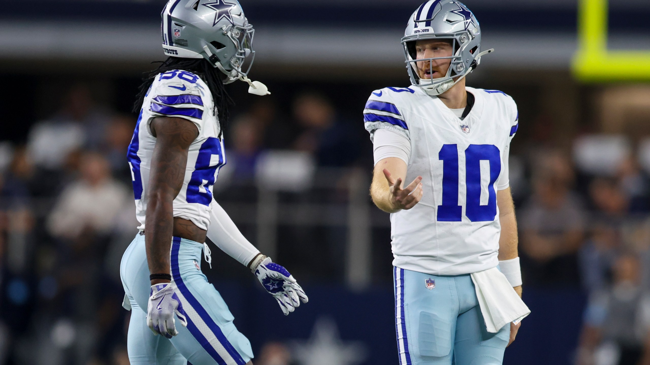 Dallas Cowboys quarterback Cooper Rush (10) and wide receiver CeeDee Lamb walk off the field after Rush threw an interception against the Houston Texans during the first half of an NFL football game, Monday, Nov. 18, 2024, in Arlington, Texas. (AP Photo/Gareth Patterson)