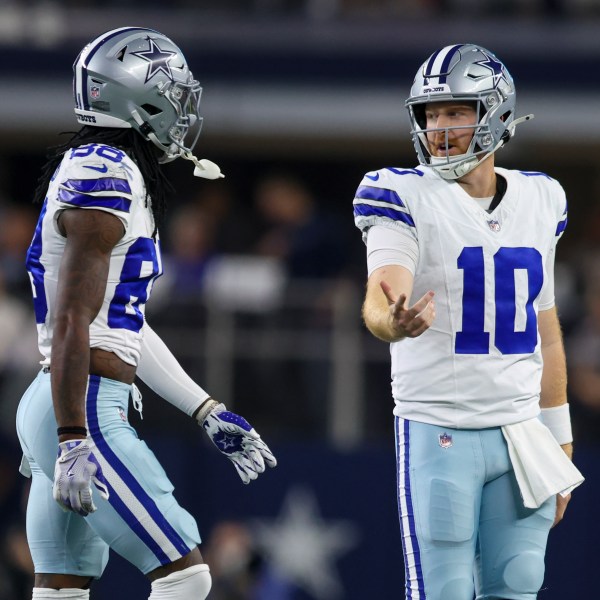 Dallas Cowboys quarterback Cooper Rush (10) and wide receiver CeeDee Lamb walk off the field after Rush threw an interception against the Houston Texans during the first half of an NFL football game, Monday, Nov. 18, 2024, in Arlington, Texas. (AP Photo/Gareth Patterson)