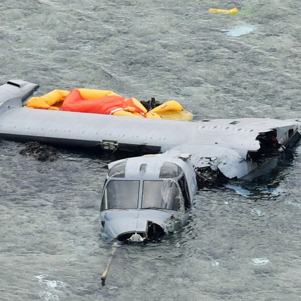 FILE - Wreckage of a U.S. military MV-22 Osprey is seen in shallow waters off Nago, Okinawa, southern Japan, Dec. 14, 2016, after it crash landed. (Yu Nakajima/Kyodo News via AP, File)