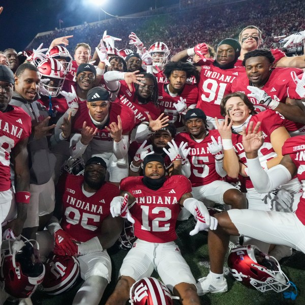 Indiana players celebrate after defeating Michigan in an NCAA college football game in Bloomington, Ind., Saturday, Nov. 9, 2024. (AP Photo/AJ Mast)