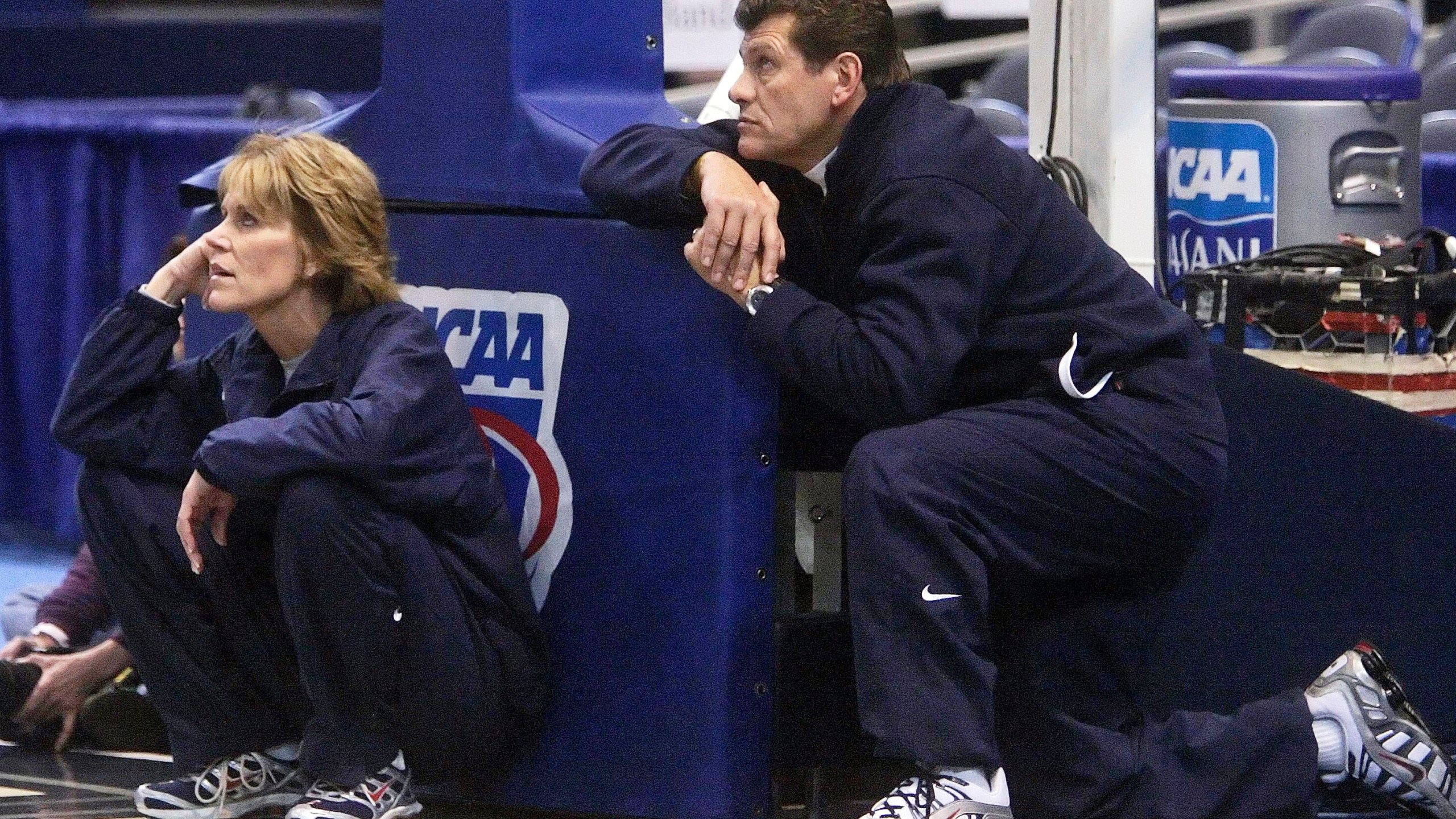 FILE - UConn coach Geno Auriemma, right, and associate head coach Chris Dailey, left, watch their team during a practice at the NCAA college basketball tournament in Hartford, Conn., Saturday, March 17, 2007.. (AP Photo/Bob Child, File)