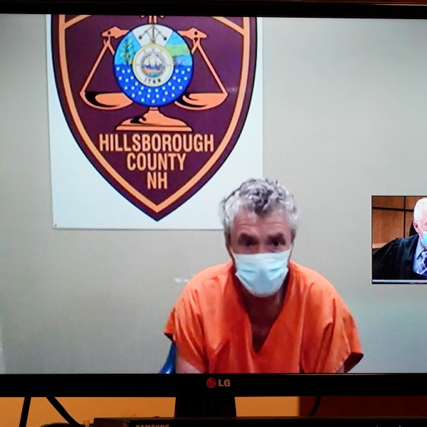 FILE - Bradley Asbury is arraigned via video as Judge William Lyons presides, at right, at Manchester, N.H., April 8, 2021. (AP Photo/Elise Amendola, Pool, File)