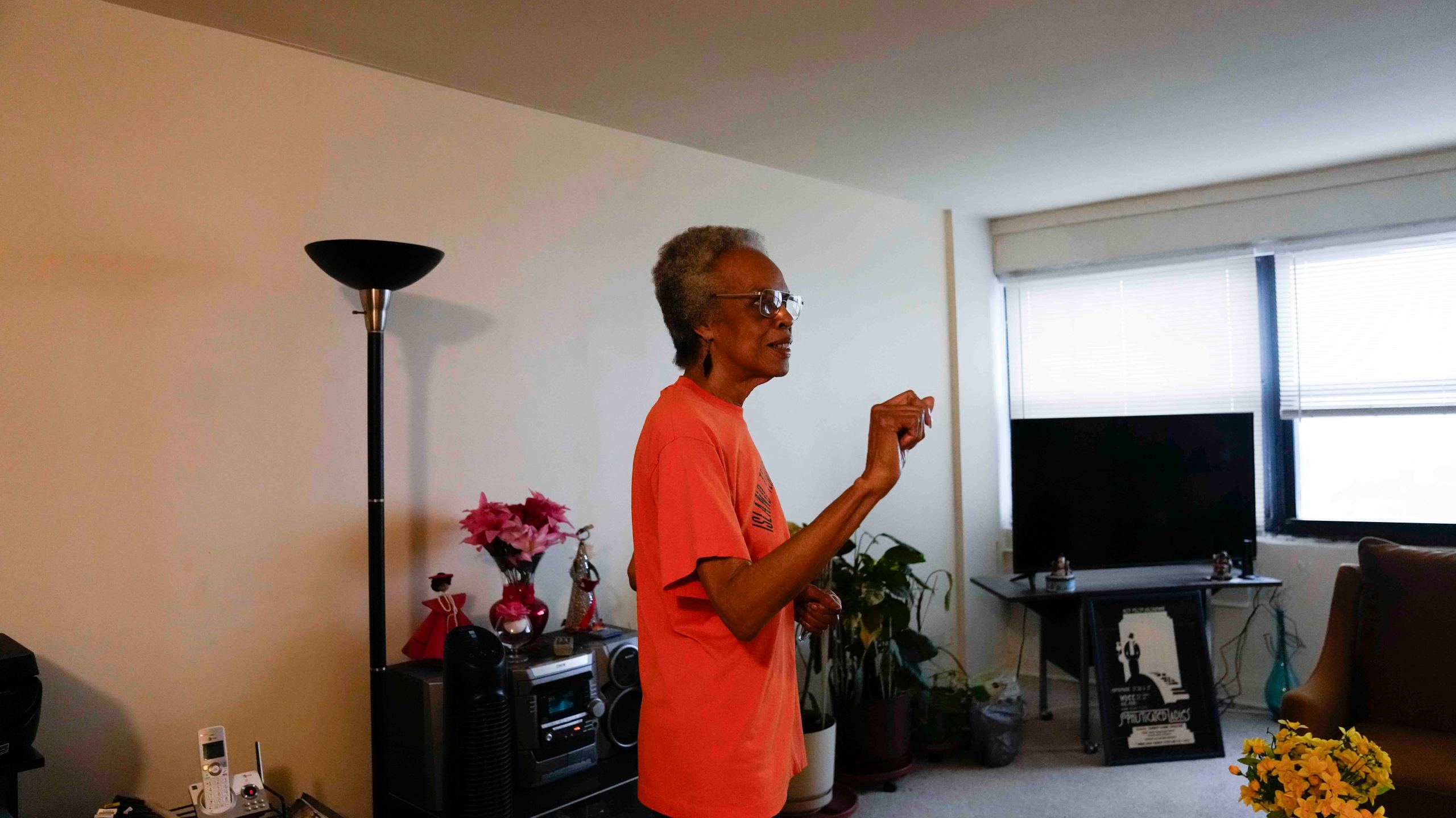 Bernadine Gibson, 82, wears an orange shirt as she talks about looking forward to renovations to the building her family has lived in for 27 years, Monday, Nov. 18, 2024, in Chicago. (AP Photo/Erin Hooley)