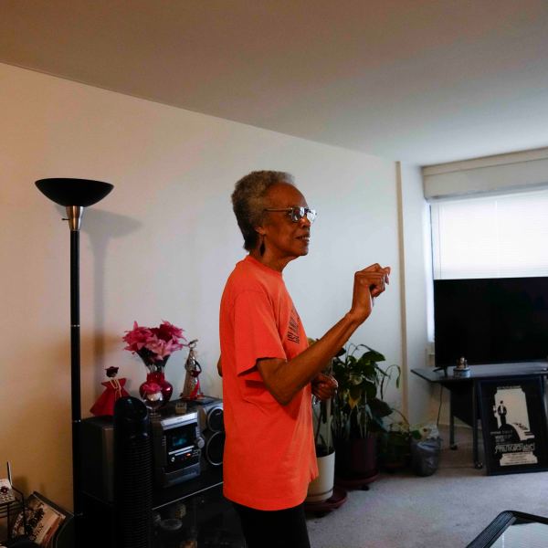 Bernadine Gibson, 82, wears an orange shirt as she talks about looking forward to renovations to the building her family has lived in for 27 years, Monday, Nov. 18, 2024, in Chicago. (AP Photo/Erin Hooley)