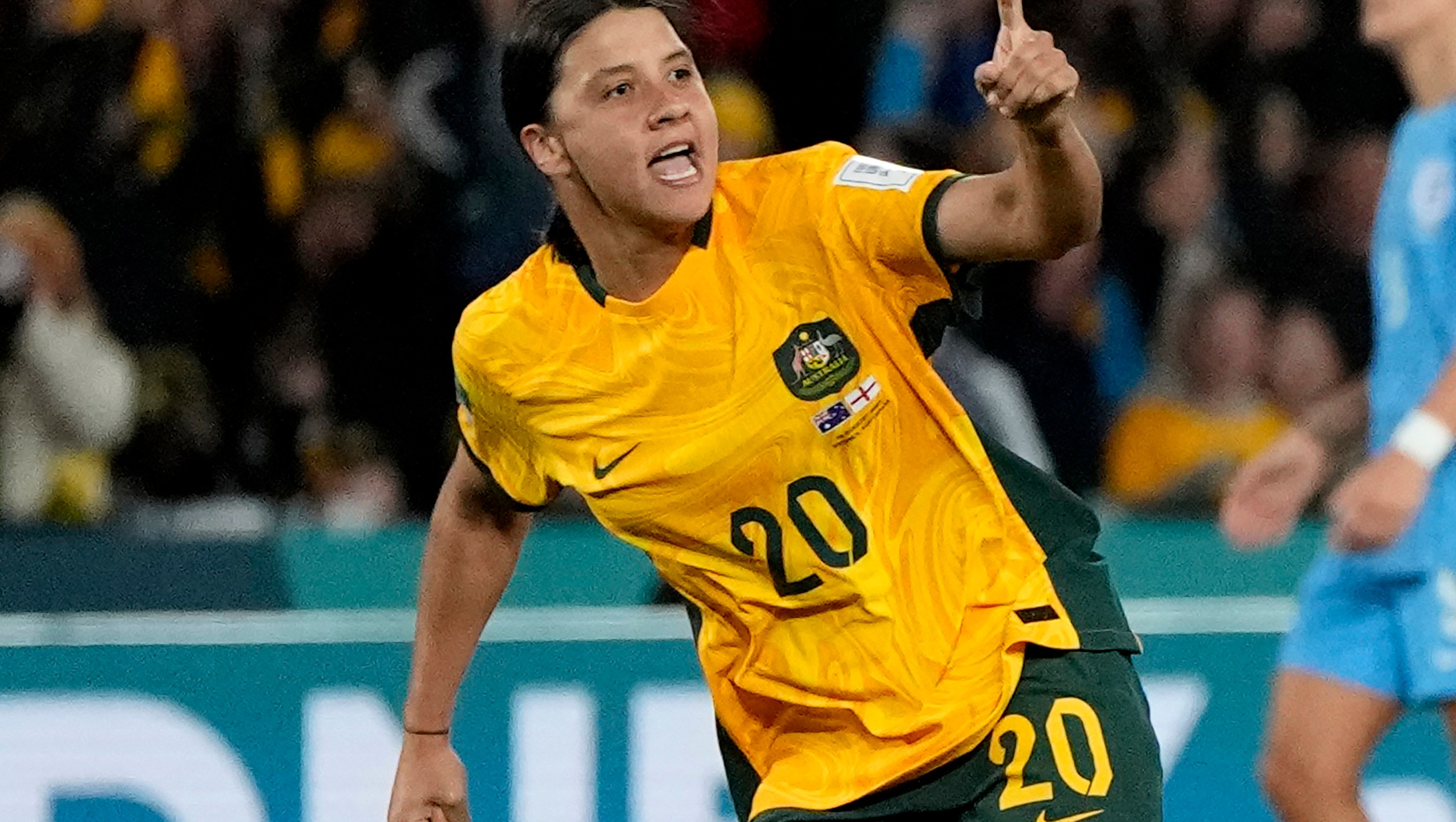 FILE - Australia's Sam Kerr celebrates after scoring her side's first goal during the Women's World Cup semifinal soccer match between Australia and England at Stadium Australia in Sydney, Australia, on Aug. 16, 2023. (AP Photo/Rick Rycroft, File)