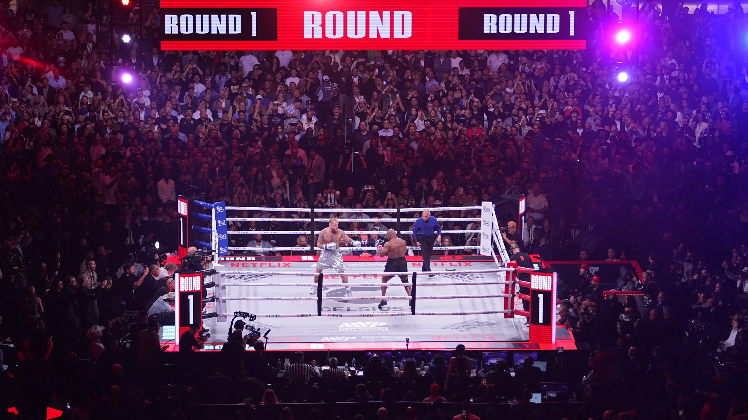 Jake Paul, left, and Mike Tyson fight during their heavyweight boxing match, Friday, Nov. 15, 2024, in Arlington, Texas. (AP Photo/Julio Cortez)