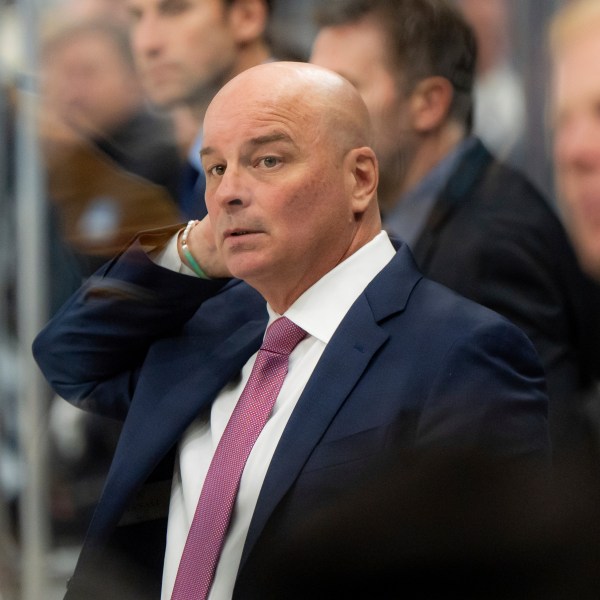 Boston Bruins head coach Jim Montgomery watches the action during the second period of an NHL hockey game against the Utah Hockey Club, Saturday, Oct. 19, 2024, in Salt Lake City. (AP Photo/Spenser Heaps)