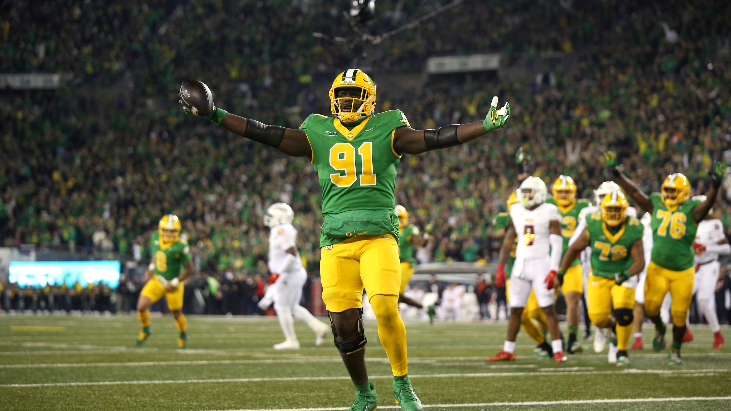 Oregon offensive lineman Gernorris Wilson (91) celebrates his touchdown reception during an NCAA college football game against Maryland, Saturday, Nov. 9, 2024, in Eugene, Ore. (AP Photo/Lydia Ely)