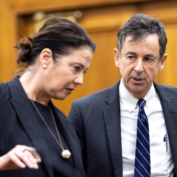 Prosecutor Sheila Ross and defense attorney John Donnelly confer during Jose Ibarra's trial at the Athens-Clarke County Superior Court, Tuesday, Nov. 19, 2024, in Athens, Ga. (Arvin Temkar/Atlanta Journal-Constitution via AP, Pool)