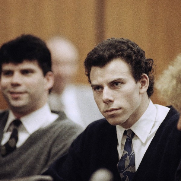 FILE - Lyle, left, and Erik Menendez sit with defense attorney Leslie Abramson, right, in the Municipal Court in the Beverly Hills area of Los Angeles, during a hearing, Nov. 26, 1990. (AP Photo/Nick Ut, File)