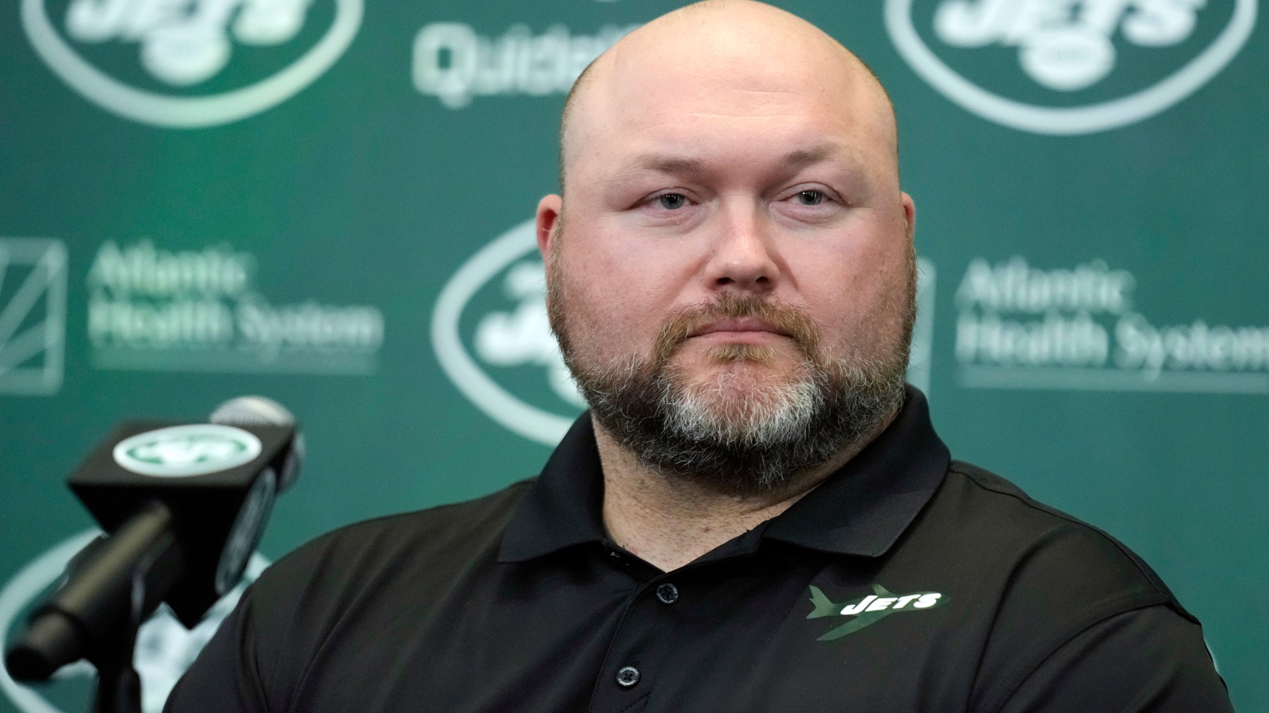 FILE - New York Jets general manager Joe Douglas listens during a news conference at the team's NFL football training facility in Florham Park, N.J., Wednesday, April 26, 2023. (AP Photo/Seth Wenig, File)