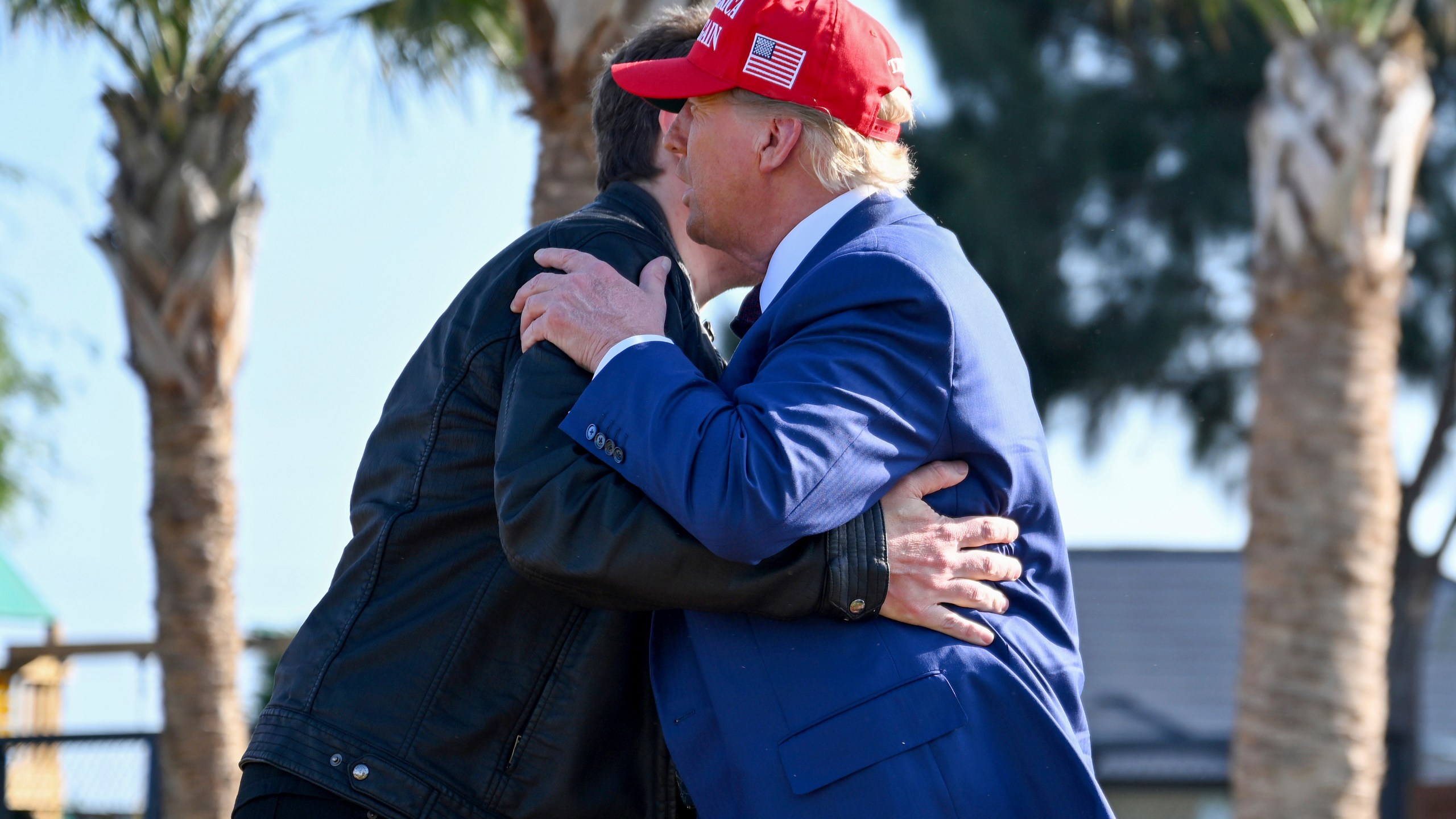 President-elect Donald Trump greets Elon Musk before the launch of the sixth test flight of the SpaceX Starship rocket Tuesday, Nov. 19, 2024 in Boca Chica, Texas. (Brandon Bell/Pool via AP)