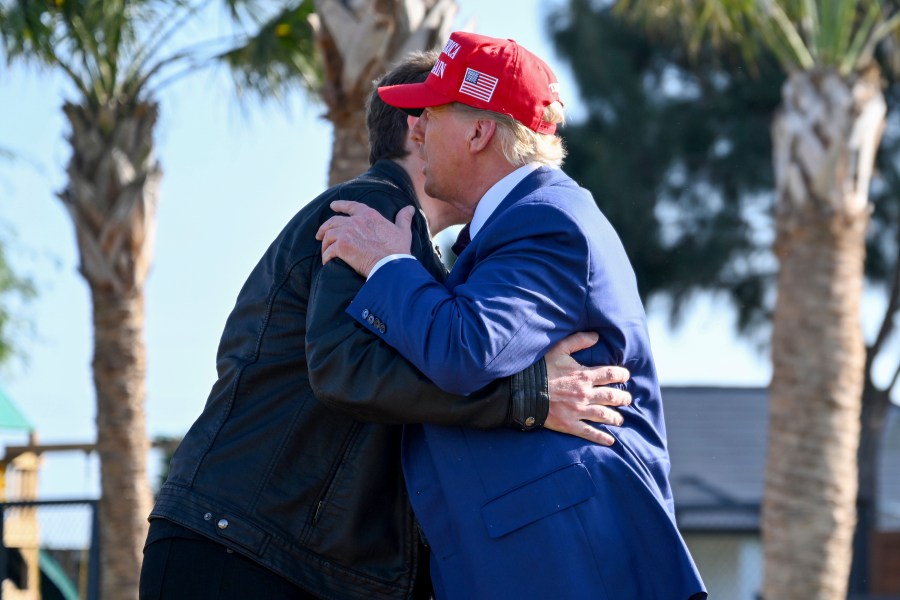 President-elect Donald Trump greets Elon Musk before the launch of the sixth test flight of the SpaceX Starship rocket Tuesday, Nov. 19, 2024 in Boca Chica, Texas. (Brandon Bell/Pool via AP)