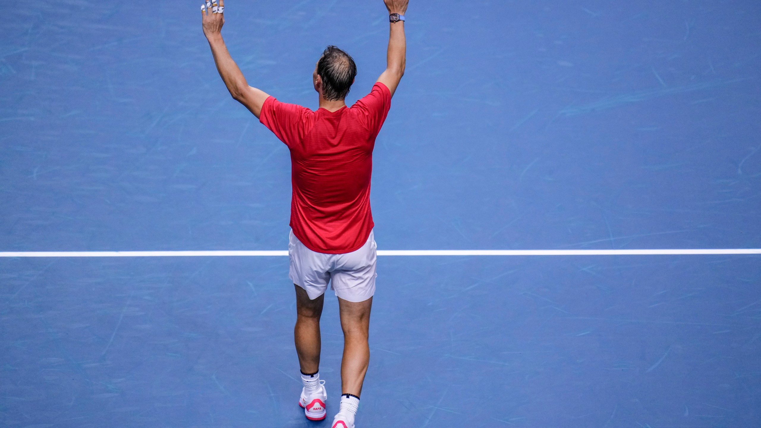 Spain's tennis player Rafael Nadal waves to the crowd after losing against Netherlands' Botic Van De Zandschulp during a Davis Cup quarterfinal match at Martin Carpena Sports Hall in Malaga, southern Spain, on Tuesday, Nov. 19, 2024. (AP Photo/Manu Fernandez)