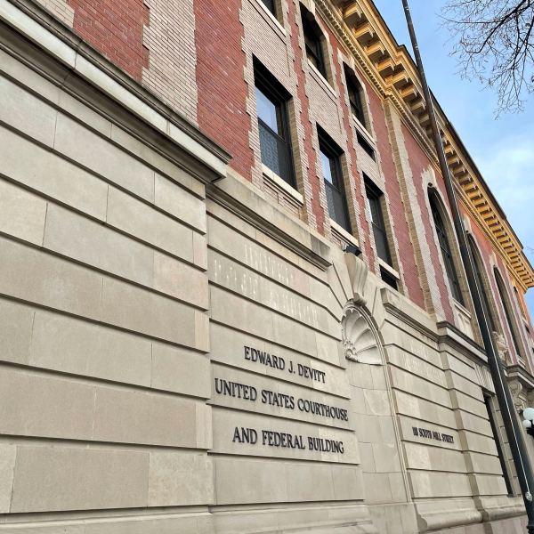 The Edward J. Devitt U.S. Courthouse and Federal building is seen, where two men on trial face human smuggling charges, Monday, Nov. 18, 2024, in Fergus Falls, Minn. (AP Photo/Michael Goldberg)