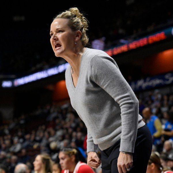 FILE - Utah head coach Lynne Roberts reacts in the first half of an NCAA college basketball game against South Carolina, Dec. 10, 2023, in Uncasville, Conn. (AP Photo/Jessica Hill, File)