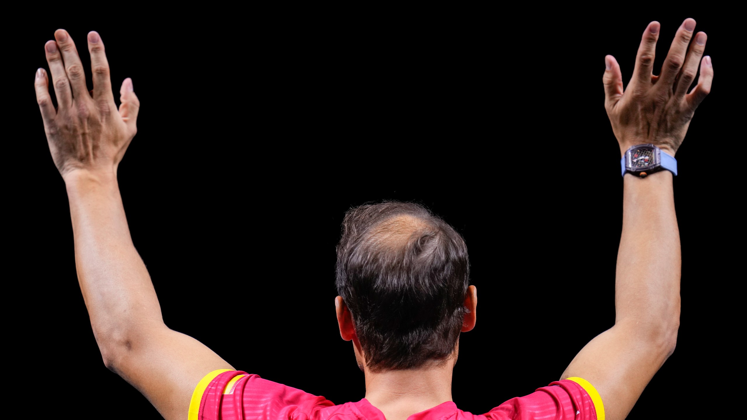 Spain's Rafael Nadal waves to the crowd during a tribute after playing his last match as a professional tennis player in the Davis Cup quarterfinals at the Martin Carpena Sports Hall in Malaga, southern Spain, on early Wednesday, Nov. 20, 2024. (AP Photo/Manu Fernandez)