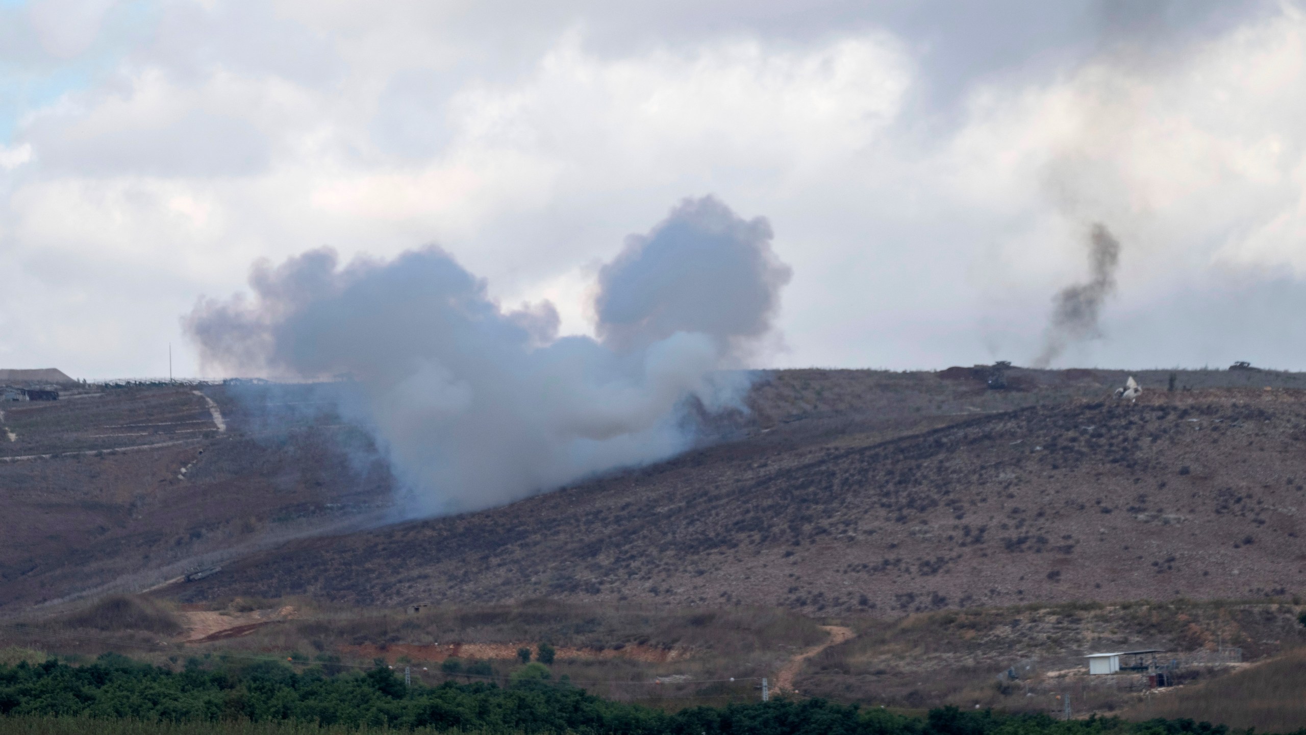 An explosion can be seen along Israel's northern border with Lebanon, Wednesday, Nov. 20, 2024. (AP Photo/Ohad Zwigenberg)