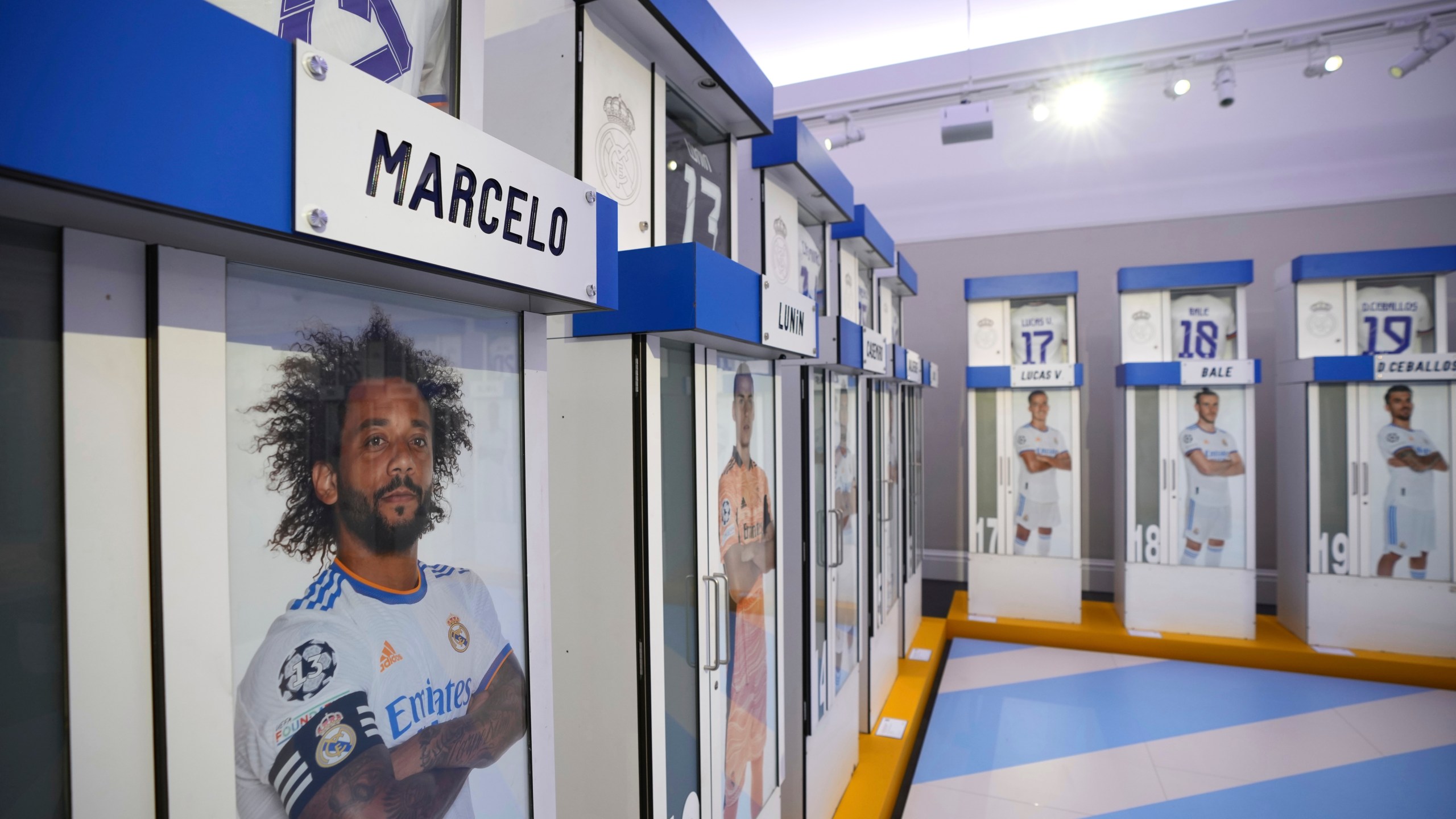 The Real Madrid first-team changing room lockers from Santiago Bernabeu Stadium are displayed at Sotheby's auction rooms in London, Wednesday, Nov. 20, 2024. The sale features 24 individual lockers previously used by footballers including Cristiano Ronaldo, David Beckham and Zinedine Zidane. (AP Photo/Kin Cheung)