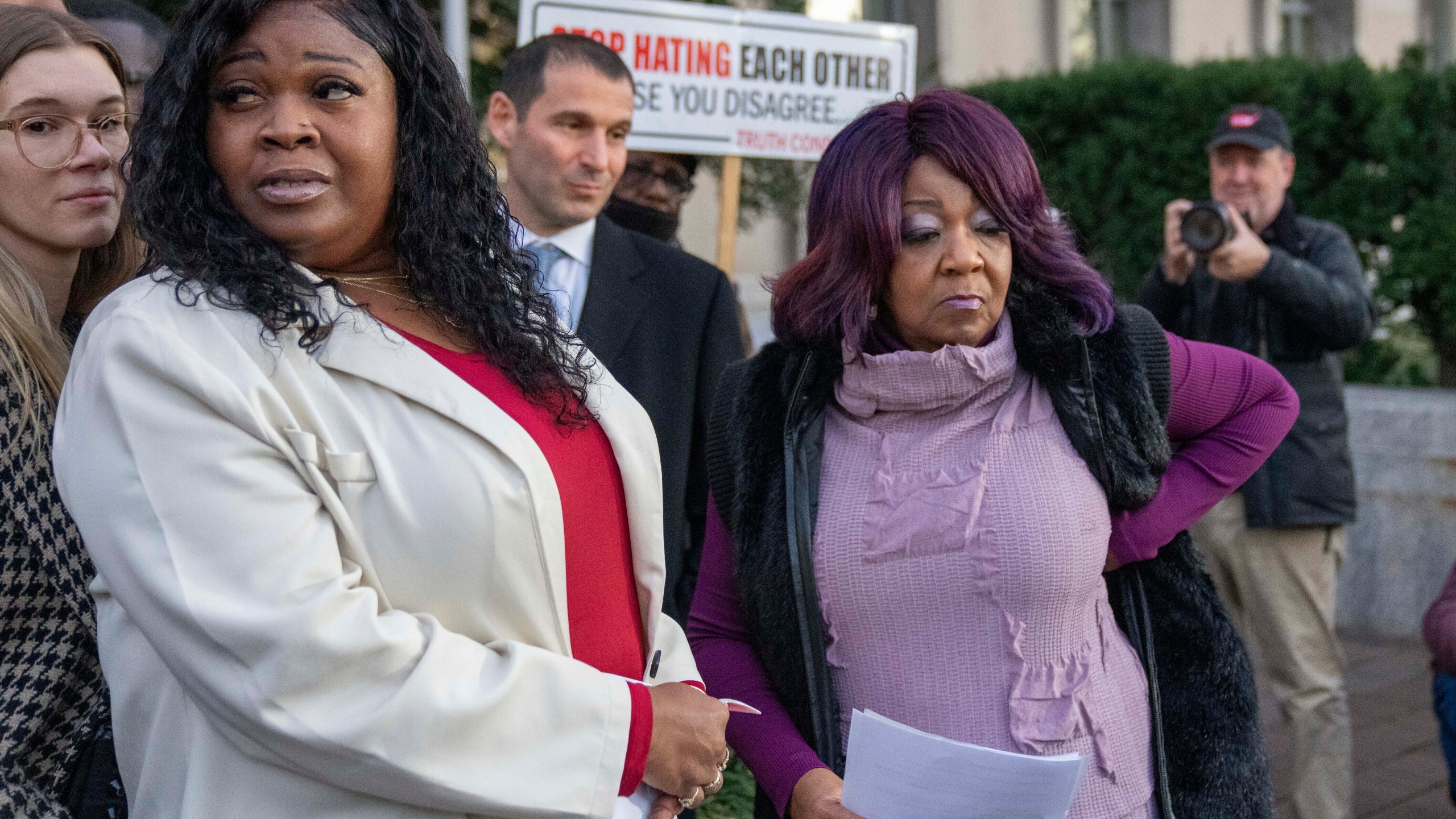 FILE - Wandrea "Shaye" Moss, left, and her mother Ruby Freeman, right, leave after speaking with reporters outside federal court, Dec. 15, 2023, in Washington. (AP Photo/Alex Brandon, File)