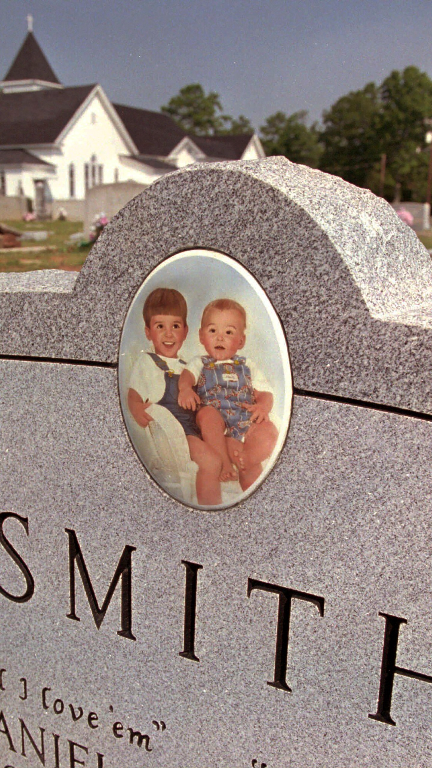 FILE - The grave of Michael and Alex Smith at the Bogansville Methodist Church in West Springs, S.C., July 23, 1995. (AP Photo/Ruth Fremson, file)