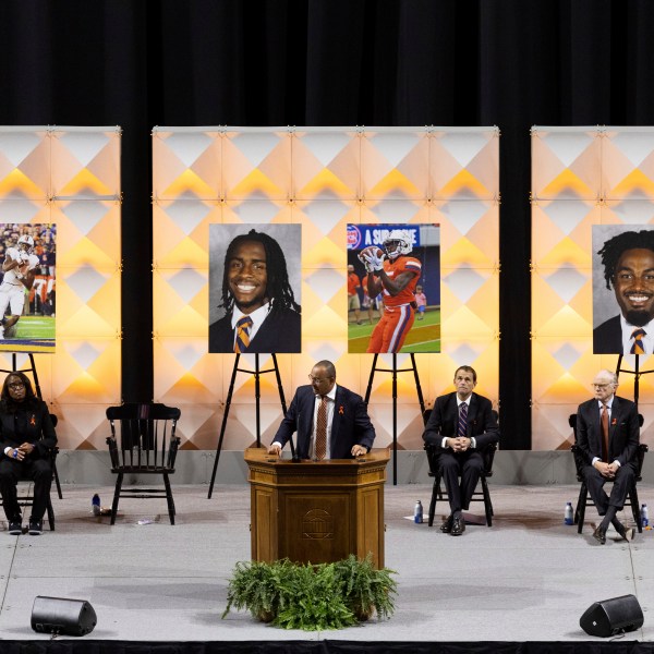 FILE - University of Virginia head football coach Tony Elliott speaks at a memorial service for Lavel Davis Jr., D’Sean Perry and Devin Chandler, Nov. 19, 2022, in Charlottesville, Va. (Mike Kropf/The Daily Progress via AP, File)