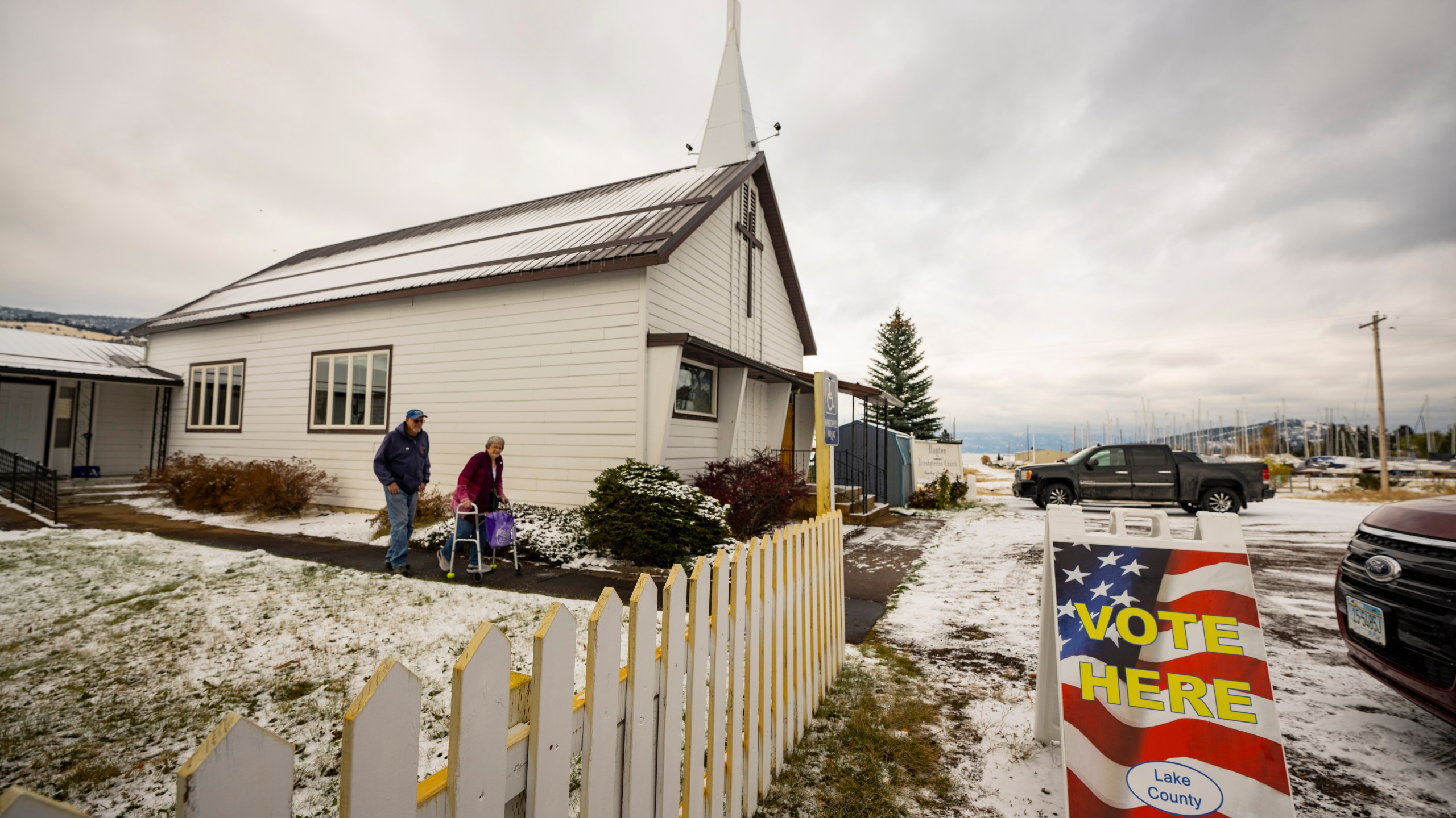 FILE - Terry and Linda Gore leave the Dayton church on the Flathead Indian Reservation after voting, Nov. 8, 2022, in Arlee, Mont. (AP Photo/Tommy Martino, File)