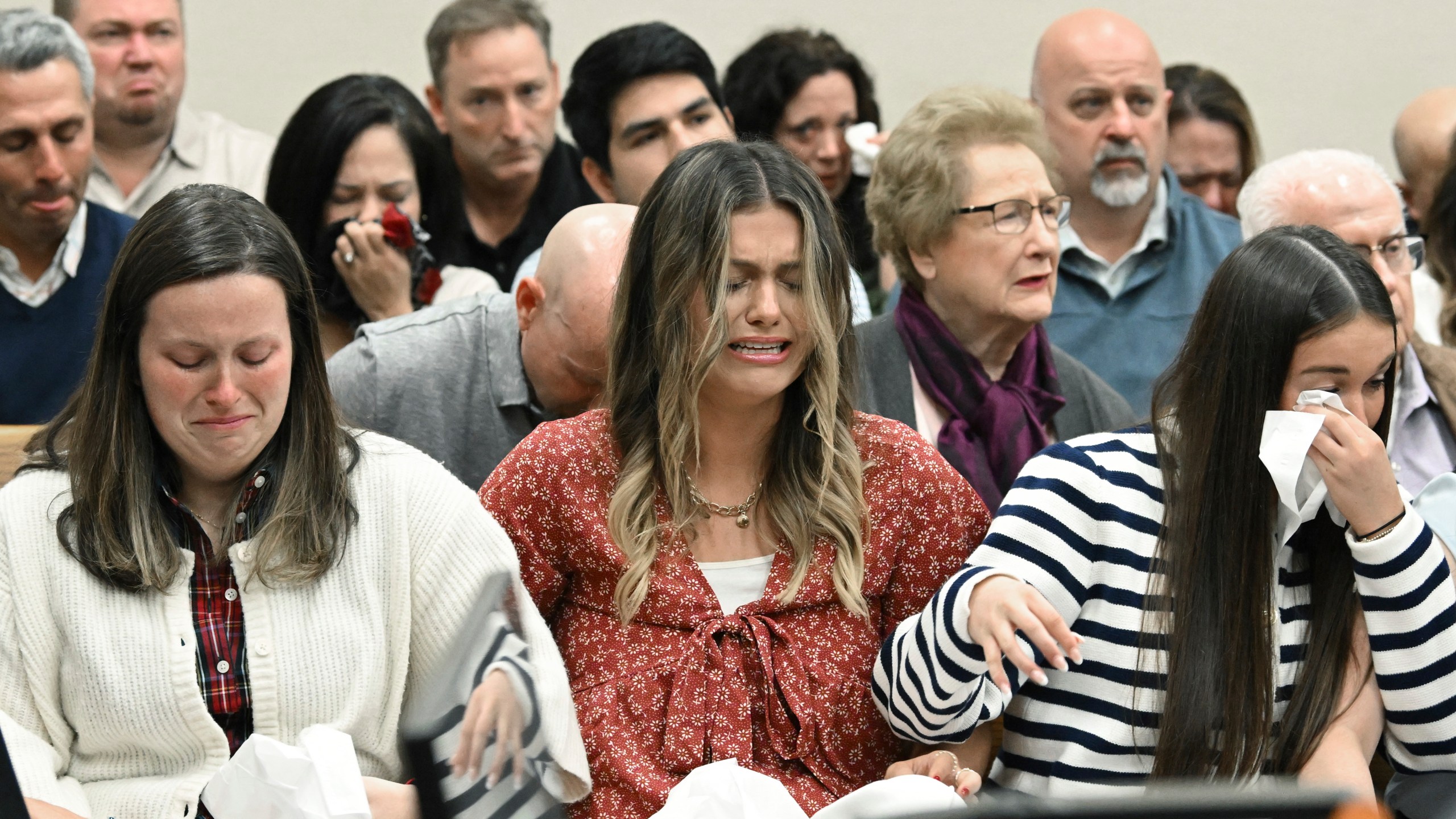 Family members and friends of Laken Riley react as Superior Court Judge H. Patrick Haggard announces the verdict during a trial of Jose Ibarra at Athens-Clarke County Superior Court, Wednesday, Nov. 20, 2024, in Athens, Ga. (Hyosub Shin/Atlanta Journal-Constitution via AP, Pool)