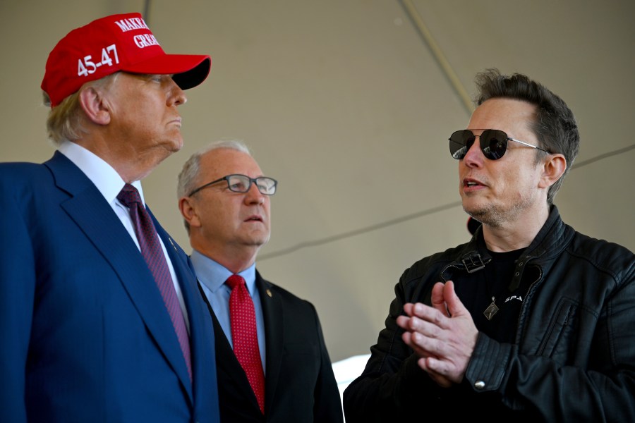 President-elect Donald Trump speaks with Elon Musk as Sen. Kevin Cramer, R-N.D., listens before attending a viewing of the launch of the sixth test flight of the SpaceX Starship rocket Tuesday, Nov. 19, 2024 in Boca Chica, Texas. (Brandon Bell/Pool via AP)