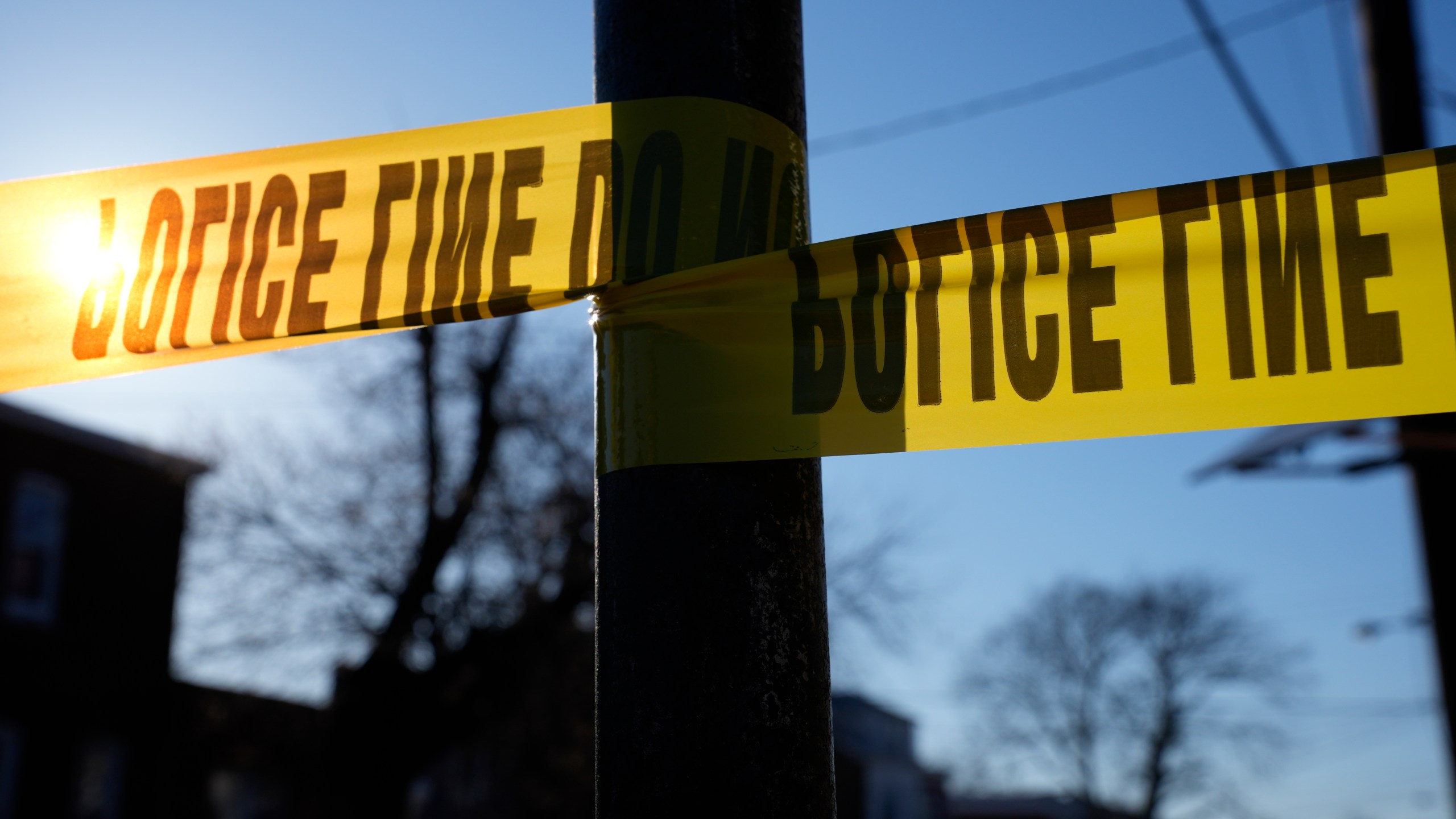 FILE - Tape cordons off a scene of police activity, Saturday, March 16, 2024, in Trenton, N.J. (AP Photo/Matt Rourke, File)