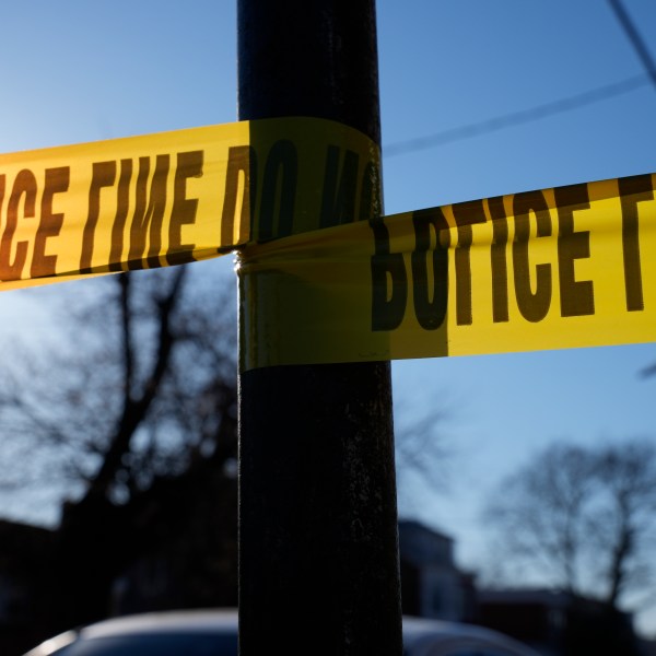 FILE - Tape cordons off a scene of police activity, Saturday, March 16, 2024, in Trenton, N.J. (AP Photo/Matt Rourke, File)