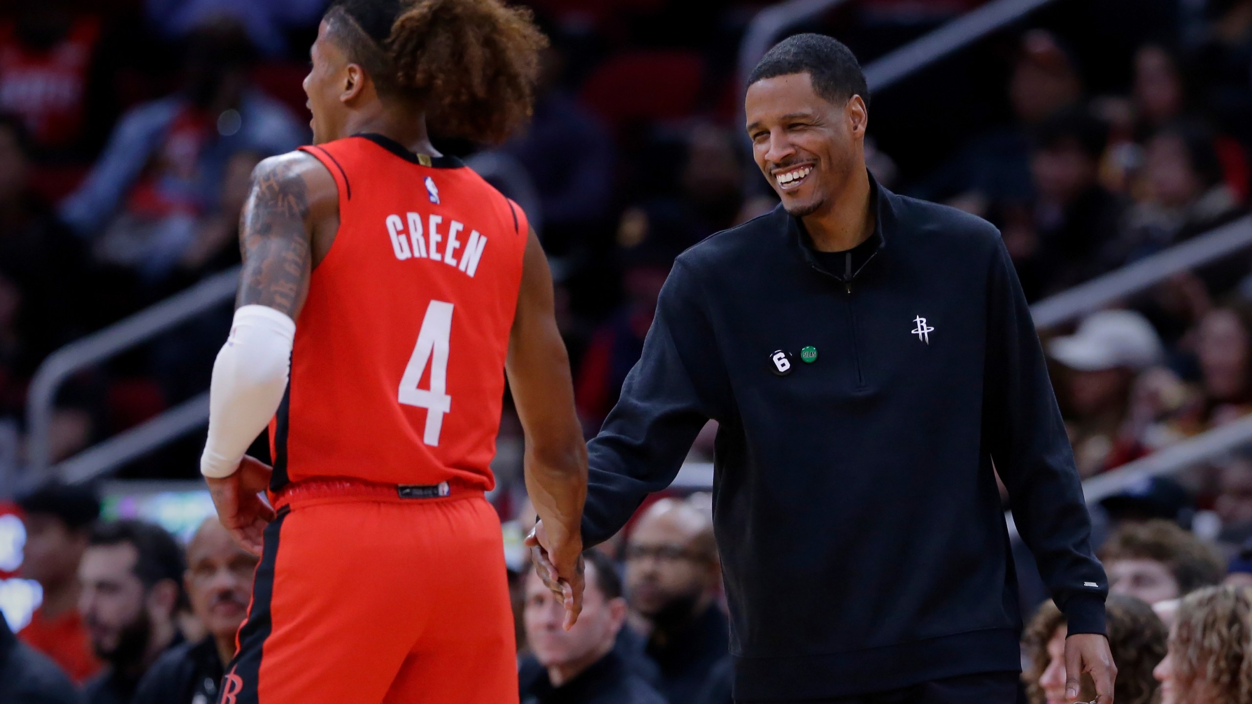 FILE - Houston Rockets guard Jalen Green (4) and head coach Stephen Silas shake hands after a score and a foul by Green against the New York Knicks during the first half of an NBA basketball game Saturday, Dec. 31, 2022, in Houston. (AP Photo/Michael Wyke, File)