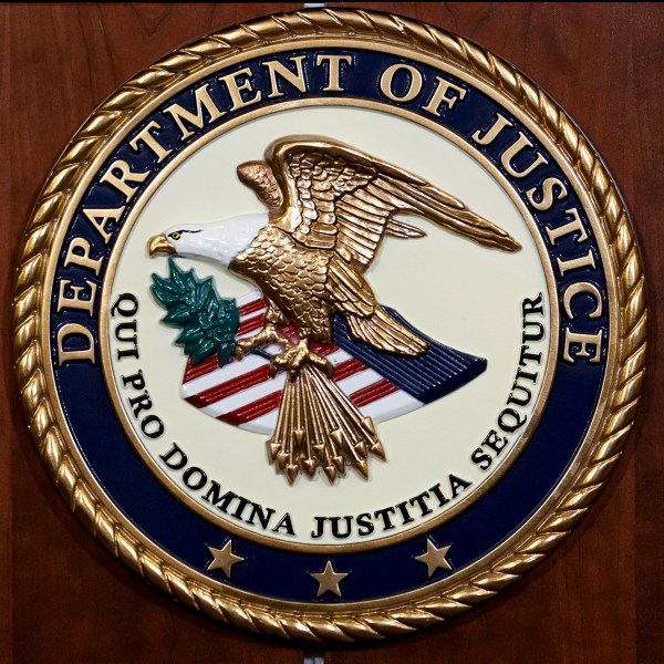 FILE - The seal of the Department of Justice is pictured, Aug. 1, 2023, in Washington. (AP Photo/J. Scott Applewhite, File)