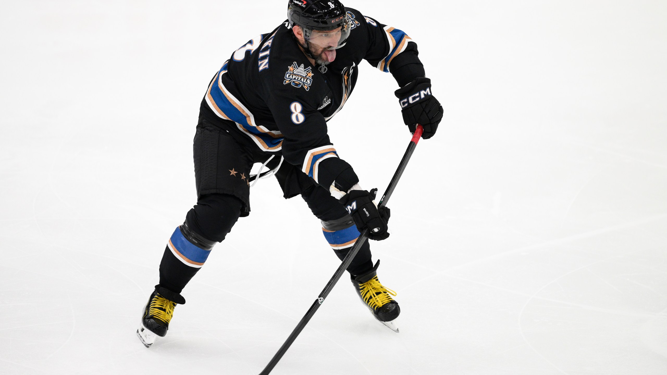 Washington Capitals left wing Alex Ovechkin (8) skates with the puck during the third period of an NHL hockey game against the Nashville Predators, Wednesday, Nov. 6, 2024, in Washington. The Capitals won 3-2. (AP Photo/Nick Wass)