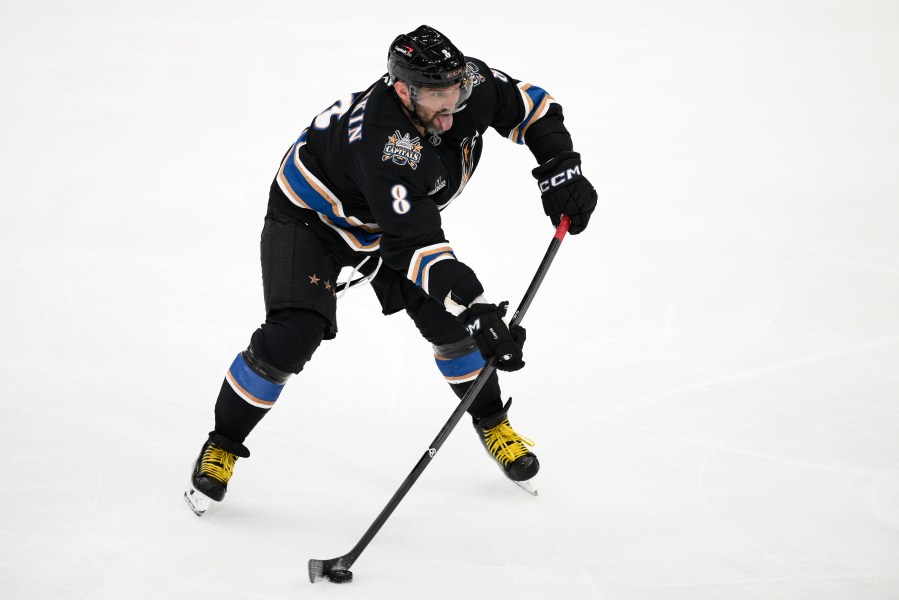 Washington Capitals left wing Alex Ovechkin (8) skates with the puck during the third period of an NHL hockey game against the Nashville Predators, Wednesday, Nov. 6, 2024, in Washington. The Capitals won 3-2. (AP Photo/Nick Wass)