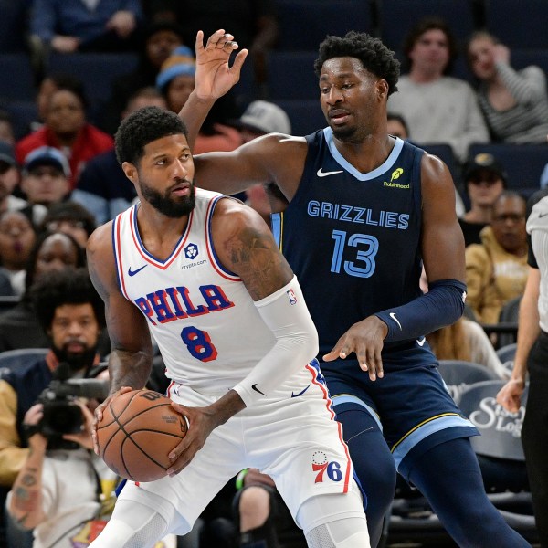 Philadelphia 76ers forward Paul George (8) handles the ball against Memphis Grizzlies forward Jaren Jackson Jr. (13) in the first half of an NBA basketball game Wednesday, Nov. 20, 2024, in Memphis, Tenn. (AP Photo/Brandon Dill)