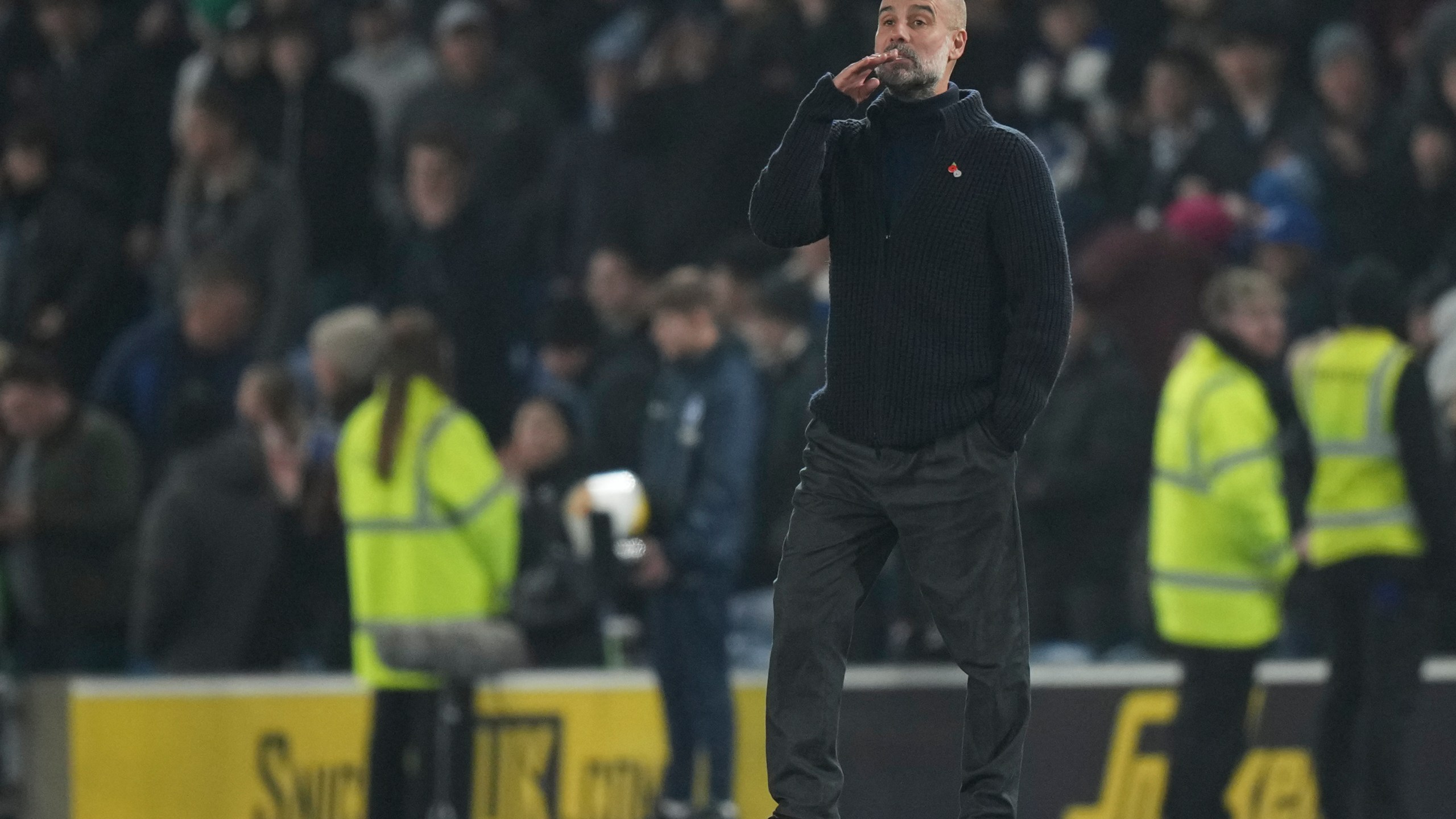 Manchester City's head coach Pep Guardiola stands after the English Premier League soccer match between Brighton and Manchester City at Falmer Stadium in Brighton, England, Saturday, Nov. 9, 2024. (AP Photo/Alastair Grant)