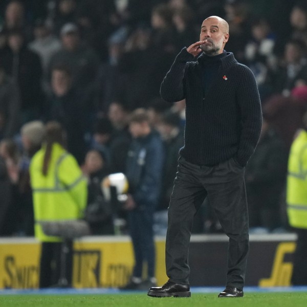 Manchester City's head coach Pep Guardiola stands after the English Premier League soccer match between Brighton and Manchester City at Falmer Stadium in Brighton, England, Saturday, Nov. 9, 2024. (AP Photo/Alastair Grant)