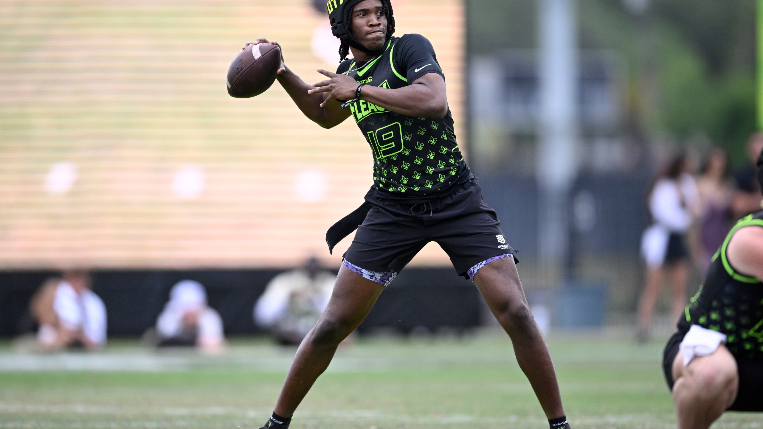 FILE - Fleaux quarterback Bryce Underwood (19) during the OT7 Orlando football tournament against Raw, April 27, 2024, in Orlando, Fla. (AP Photo/Phelan M. Ebenhack, File)