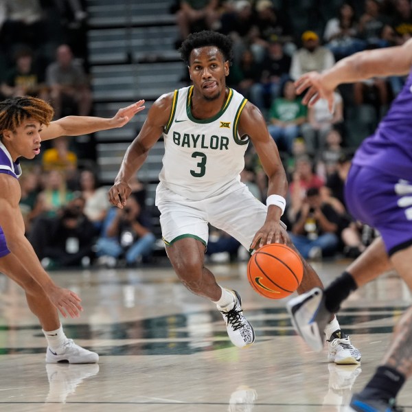 Baylor guard Jeremy Roach (3) dribbles against Tarleton State guards Jordan Mizell (4) and Izzy Miles (0) during the first half of an NCAA college basketball game, Sunday, Nov. 17, 2024, in Waco, Texas. (AP Photo/LM Otero)