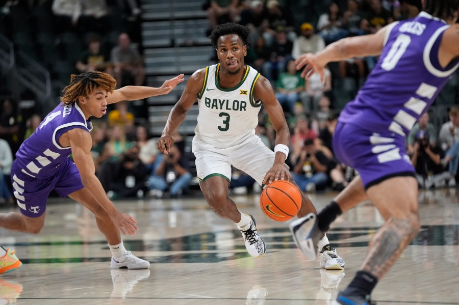 Baylor guard Jeremy Roach (3) dribbles against Tarleton State guards Jordan Mizell (4) and Izzy Miles (0) during the first half of an NCAA college basketball game, Sunday, Nov. 17, 2024, in Waco, Texas. (AP Photo/LM Otero)