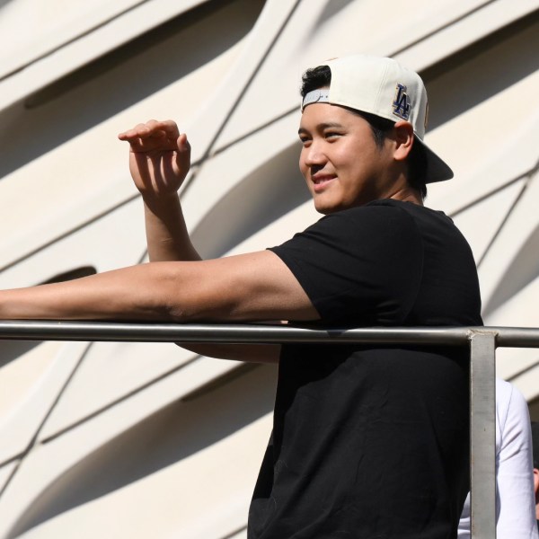 Los Angeles Dodgers' Shohei Ohtani waves at fans during the baseball team's World Series championship parade Friday, Nov. 1, 2024, in Los Angeles. (AP Photo/Kyusung Gong)