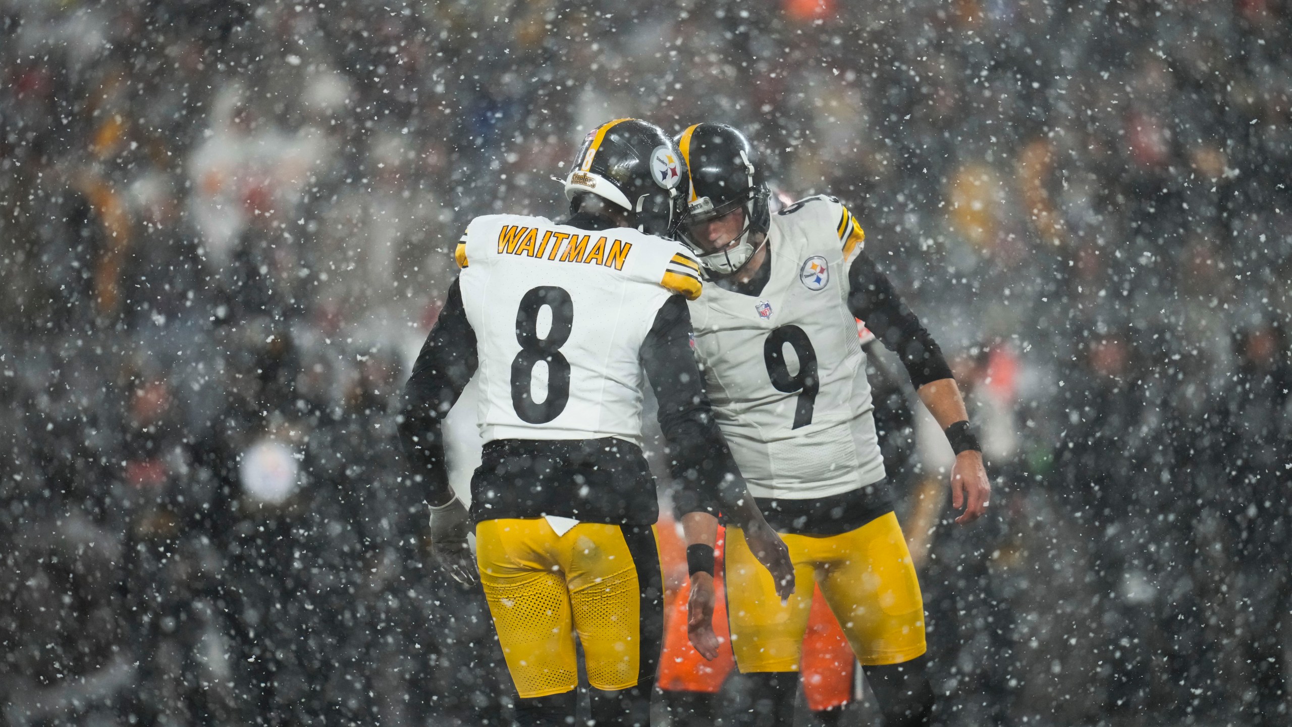 Pittsburgh Steelers place kicker Chris Boswell (9) celebrates with holder Corliss Waitman (8) in the second half of an NFL football game, Thursday, Nov. 21, 2024, in Cleveland. (AP Photo/Sue Ogrocki)