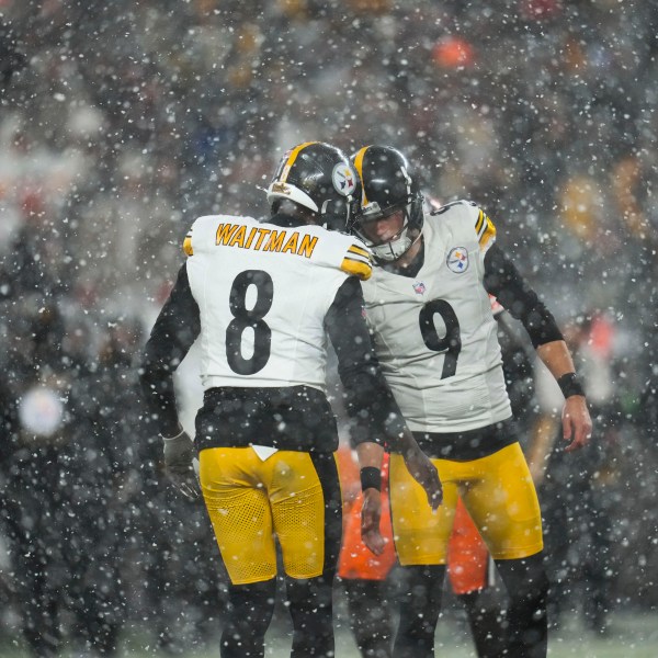 Pittsburgh Steelers place kicker Chris Boswell (9) celebrates with holder Corliss Waitman (8) in the second half of an NFL football game, Thursday, Nov. 21, 2024, in Cleveland. (AP Photo/Sue Ogrocki)