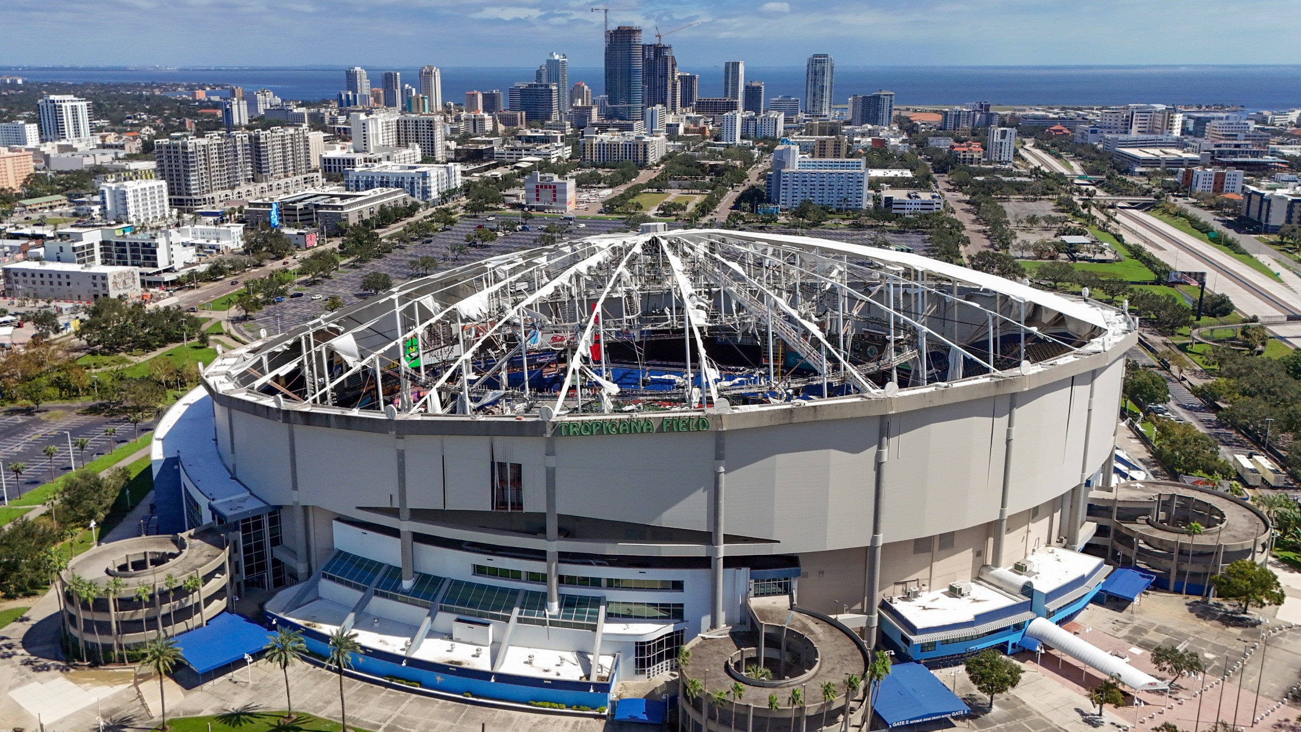 FILE - The roof of the Tropicana Field is damaged the morning after Hurricane Milton hit the region, Oct. 10, 2024, in St. Petersburg, Fla. (AP Photo/Mike Carlson, File)