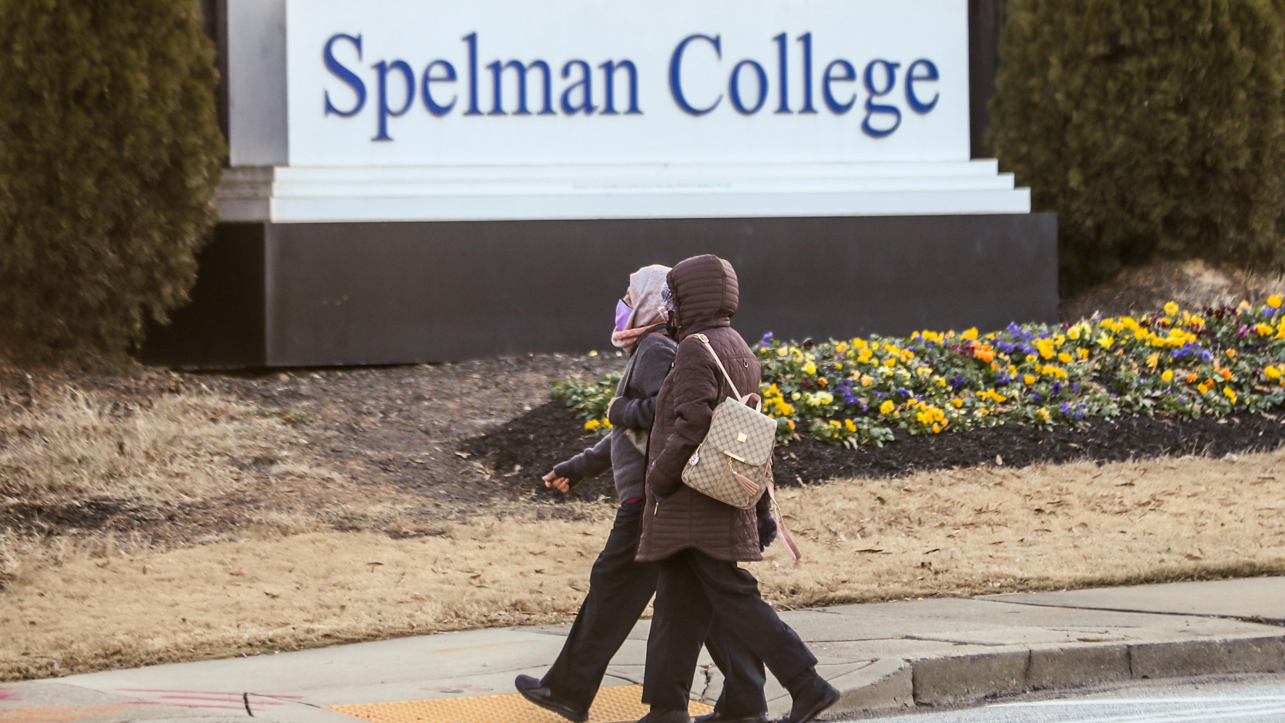 FILE - People walk outside the Spelman campus, Feb. 1, 2022, in Atlanta. (John Spink/Atlanta Journal-Constitution via AP, File)