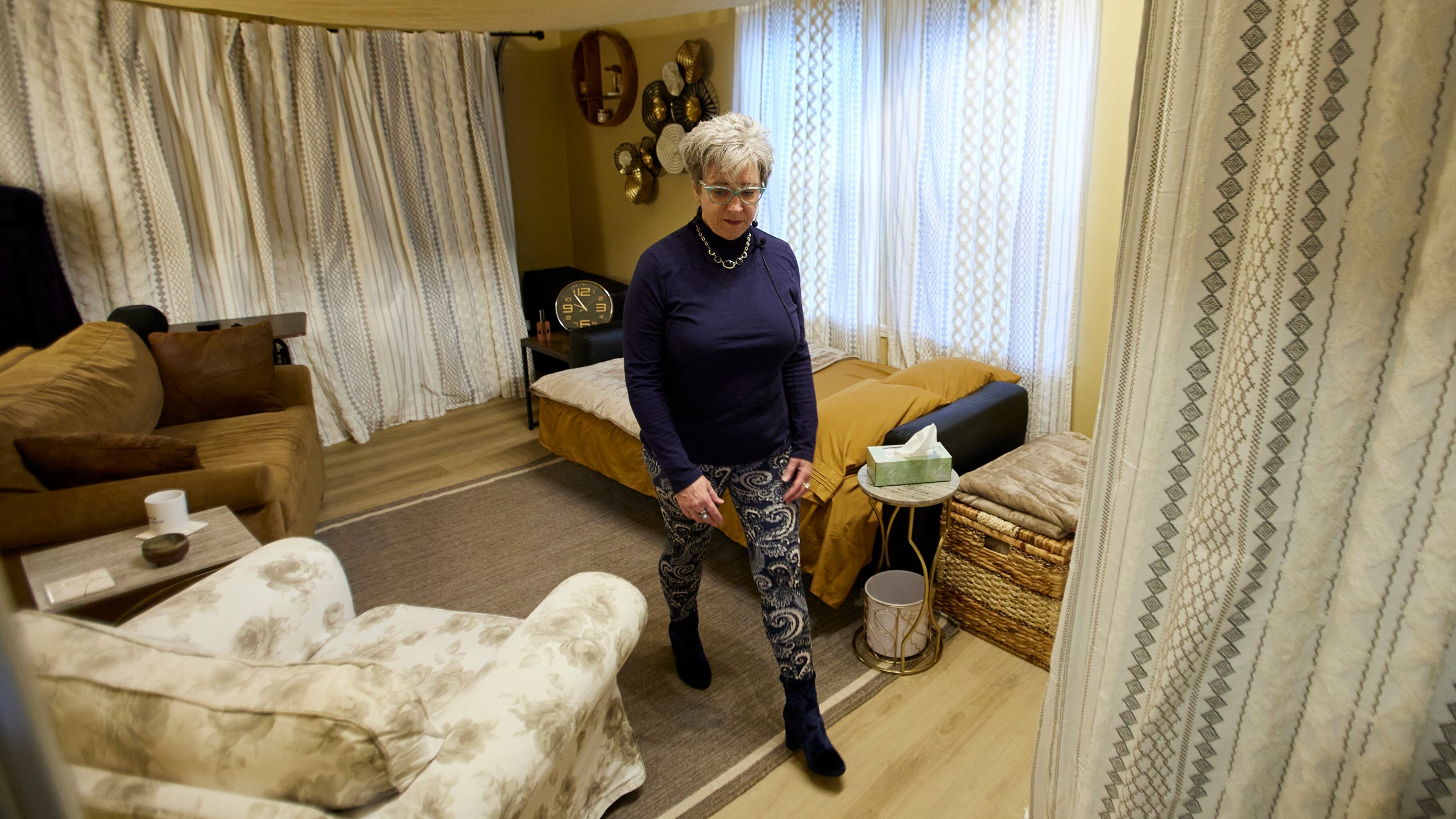 MJ Wilt, a licensed psilocybin facilitator and the owner of a licensed psilocybin service center, walks out of a room for a patient journey at her facility in Gresham, Ore., Monday, Nov. 18, 2024. (AP Photo/Craig Mitchelldyer)