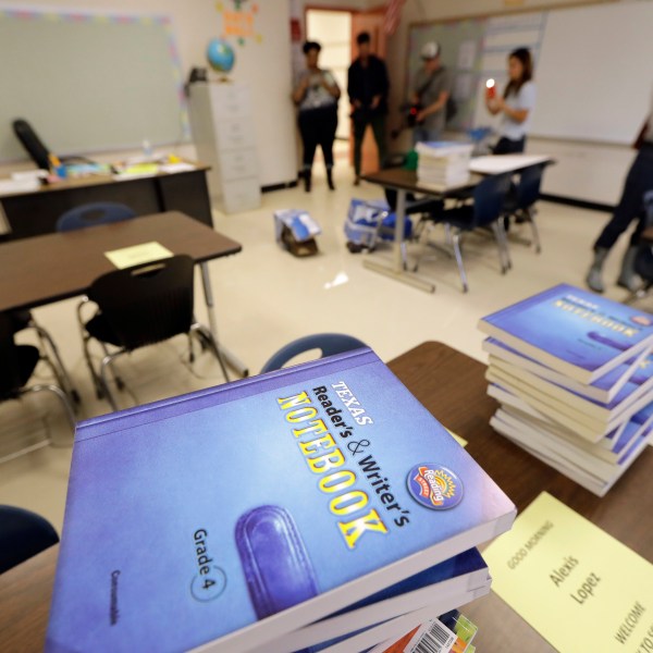 FILE - Notebooks are stacked on desks in a classroom at A.G. Hilliard Elementary School, Saturday, Sept. 2, 2017, in Houston. (AP Photo/David J. Phillip, File)