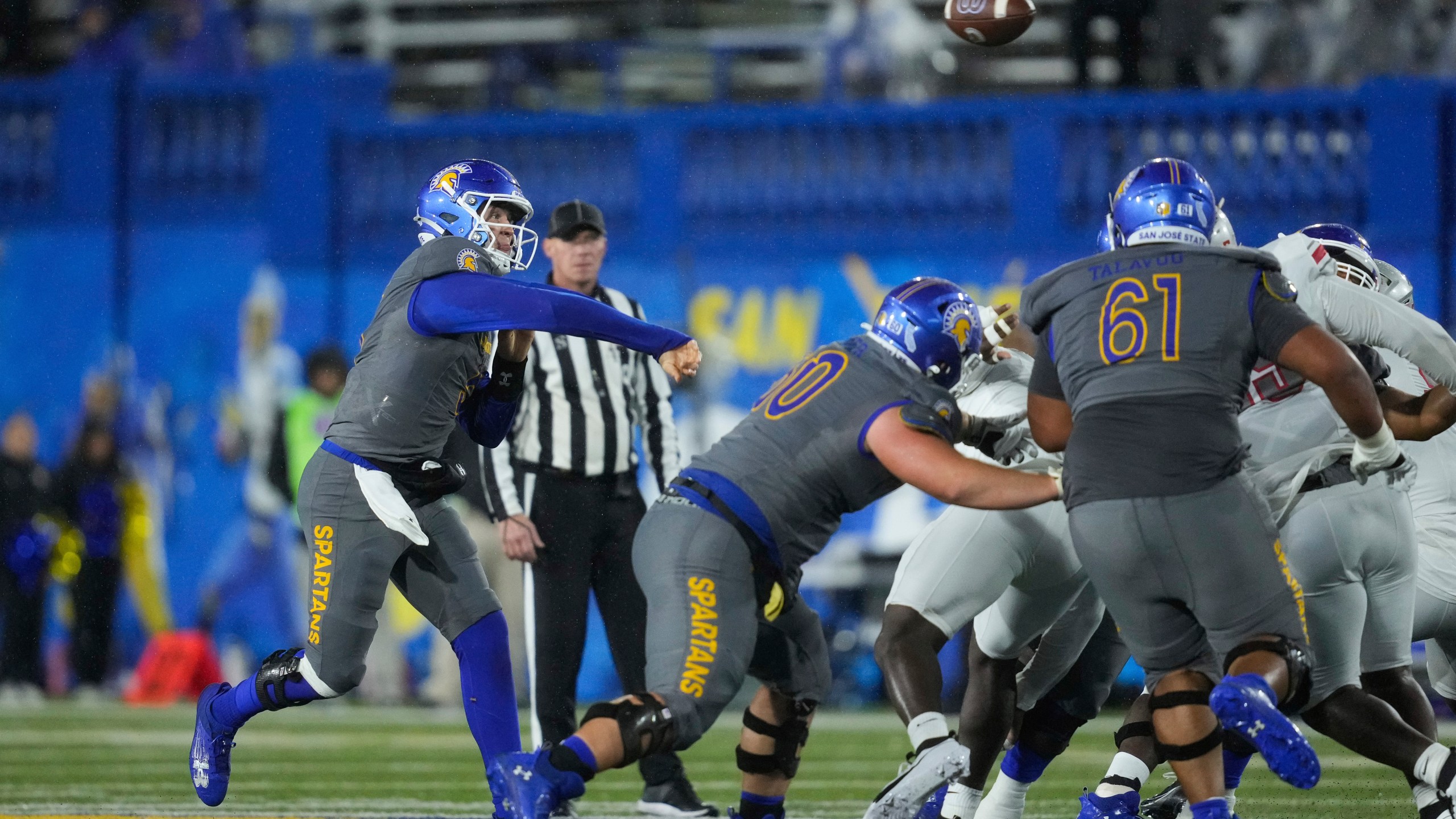 San Jose State quarterback Walker Eget, left, passes during the first half of an NCAA college football game against UNLV, Friday, Nov. 22, 2024, in San Jose, Calif. (AP Photo/Godofredo A. Vásquez)